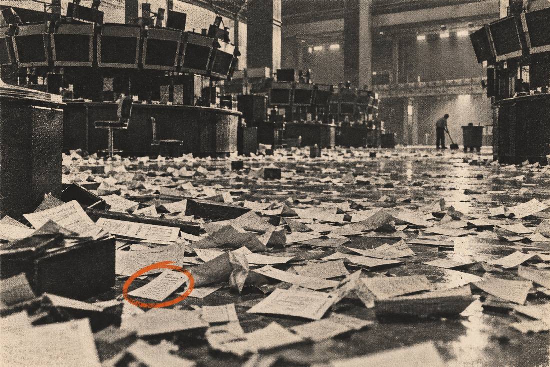 A runner carrying a fan of tickets across the exchange floor